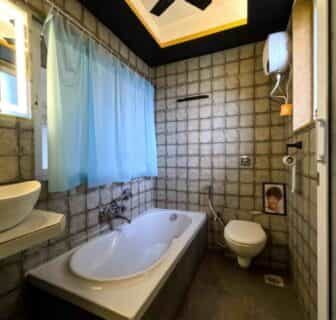 Washroom-with-attached-bathtub-St.Rickys-Apartment-Hotel